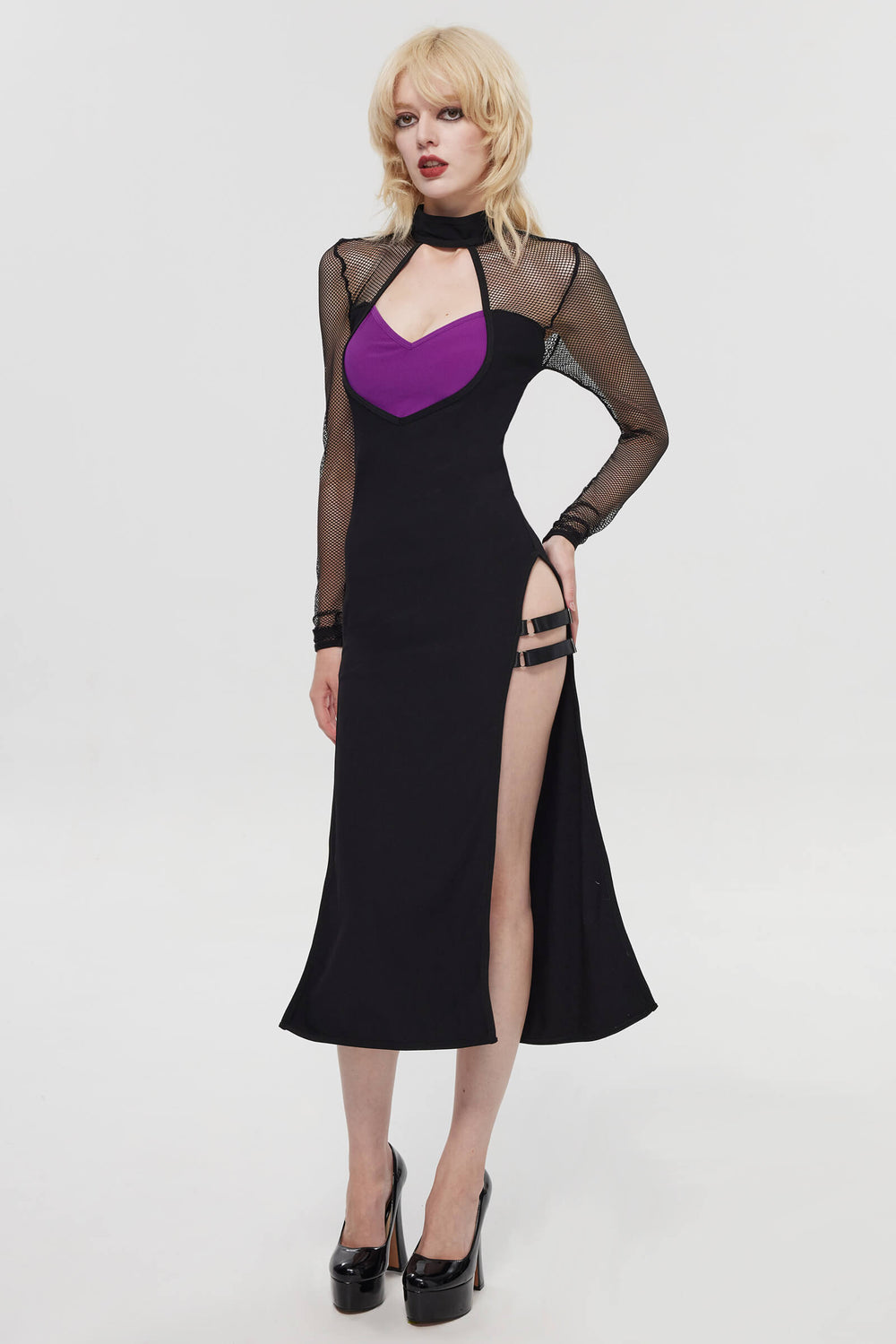 Close-up front view of the black alt fashion dress featuring a mock neck choker collar, sheer mesh chest cutout, and a purple sweetheart bustier detail.